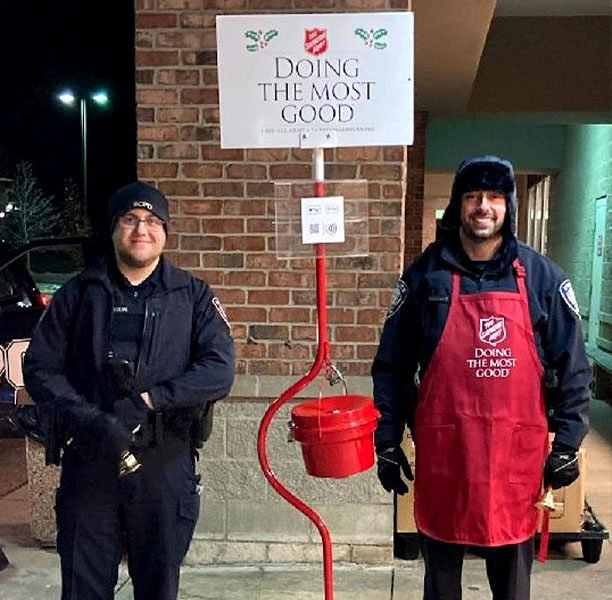 Officers ringing bell for Salvation Army donations