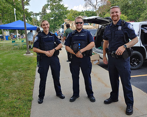 Three officers smiling